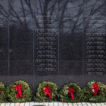 Wreaths were placed at the New Jersey Vietnam Veterans Memorial in Holmdel, New Jersey, Dec. 10, 2025. The wreaths were placed at the base of each of the memorial’s 366 eight-foot-tall black granite panels – each representing a day of the year – listing the names of the 1,564 New Jersey men and one woman who gave their lives while serving in Southeast Asia. In addition, the Wreaths Across America convoy stopped at the memorial on their annual journey to Arlington National Cemetery. This year marks the 50th anniversary of the end of the Vietnam War. (New Jersey Department of Military and Veterans Affairs photo by Mark C. Olsen)