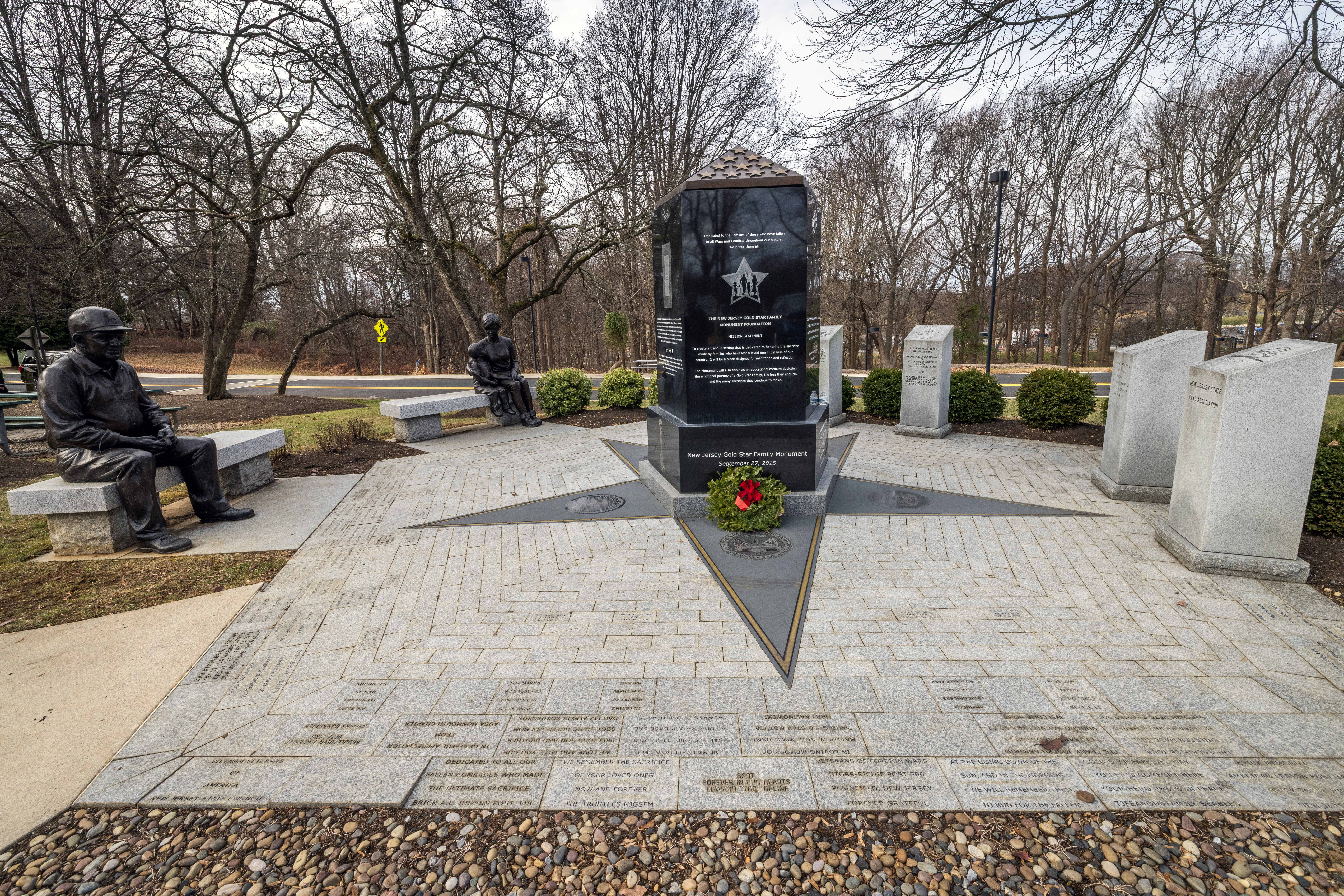 A wreath is placed at the New Jersey Gold Star Family Memorial at the New Jersey Vietnam Veterans Memorial in Holmdel, New Jersey, Dec. 10, 2025. Wreaths were placed at the base of each of the memorial’s 366 eight-foot-tall black granite panels – each representing a day of the year – listing the names of the 1,564 New Jersey men and one woman who gave their lives while serving in Southeast Asia. In addition, the Wreaths Across America convoy stopped at the memorial on their annual journey to Arlington National Cemetery. This year marks the 50th anniversary of the end of the Vietnam War. (New Jersey Department of Military and Veterans Affairs photo by Mark C. Olsen)