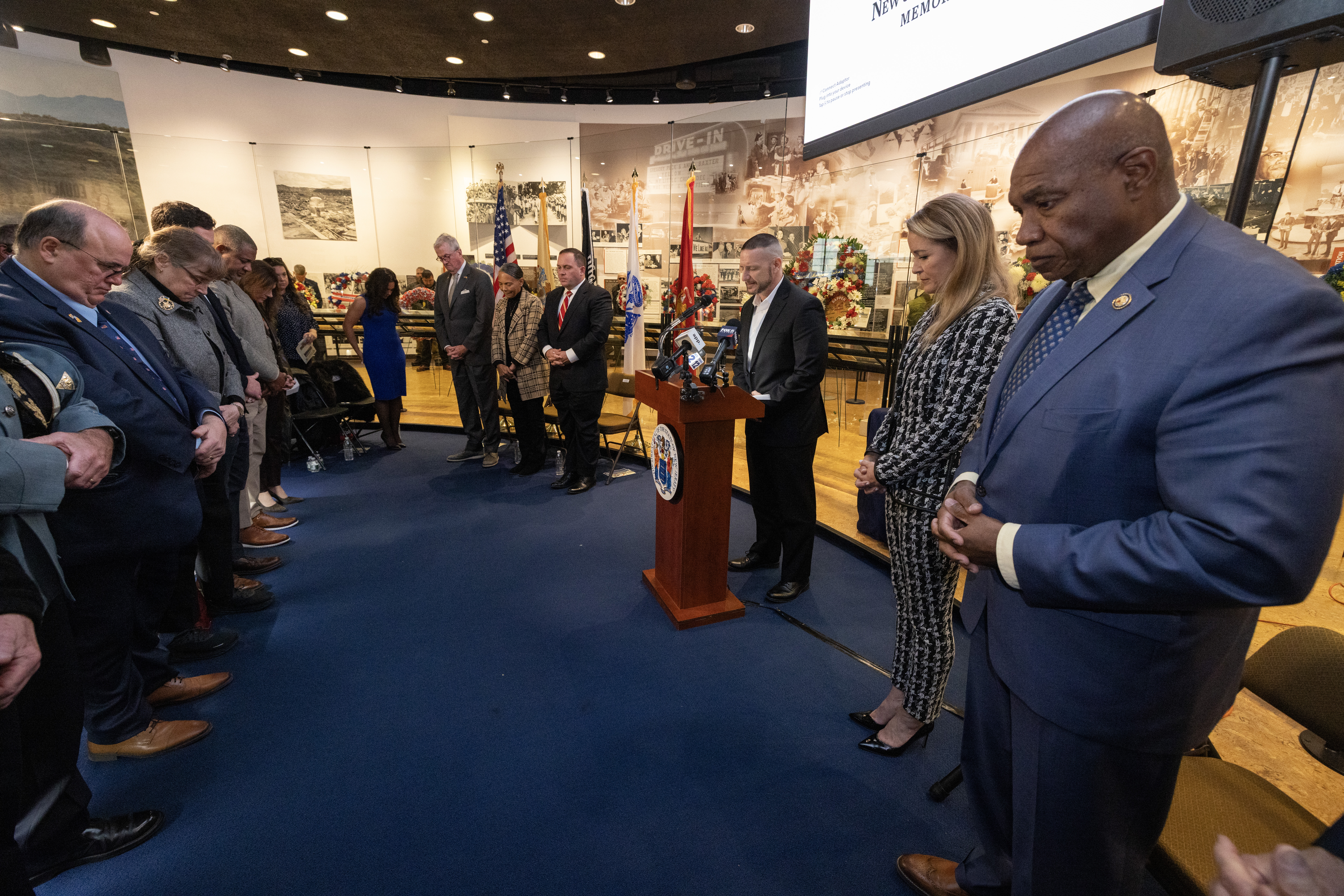 Veterans, family members, state and local officials bow their heads during the benediction at the State Veterans Day ceremony at the New Jersey Vietnam Veterans’ Memorial, Vietnam Era Museum and Educational Center at Holmdel, New Jersey, Nov. 11, 2025. Veterans Day celebrates and honors America’s veterans for their patriotism, love of country, and willingness to serve and sacrifice for the common good. (New Jersey Department of Military and Veterans Affairs photo by Mark C. Olsen)