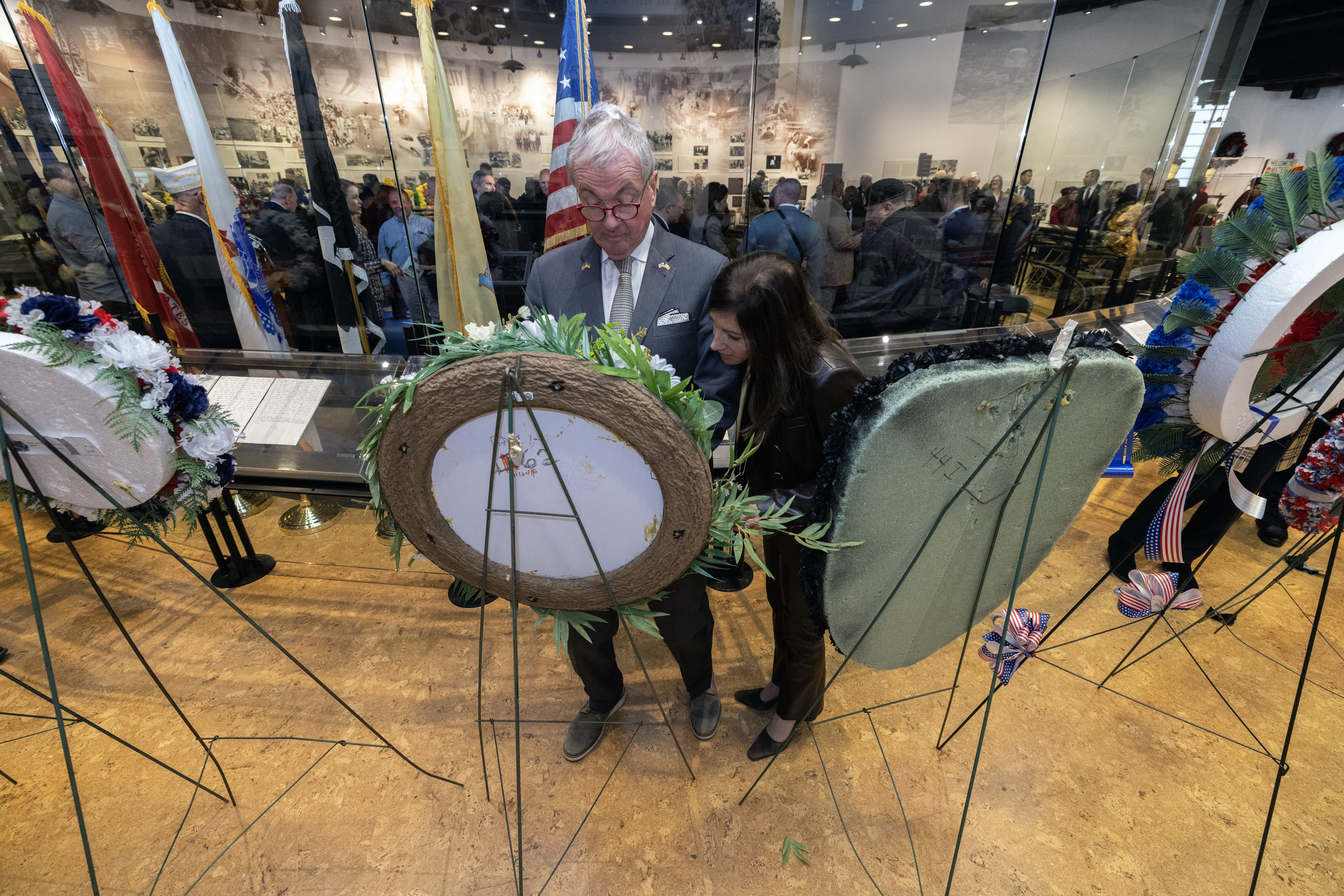 New Jersey Gov. Philip D. Murphy, left, and First Lady Tammy Murphy review the wreaths after the State Veterans Day ceremony at the New Jersey Vietnam Veterans’ Memorial, Vietnam Era Museum and Educational Center at Holmdel, New Jersey, Nov. 11, 2025. Veterans Day celebrates and honors America’s veterans for their patriotism, love of country, and willingness to serve and sacrifice for the common good. (New Jersey Department of Military and Veterans Affairs photo by Mark C. Olsen)